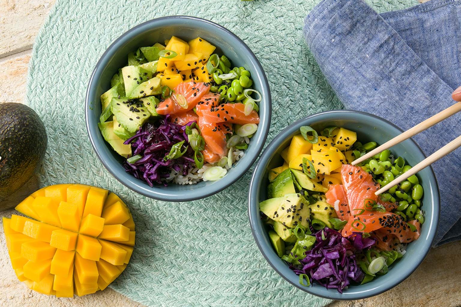 Poké bowl with salmon, avocado and mango