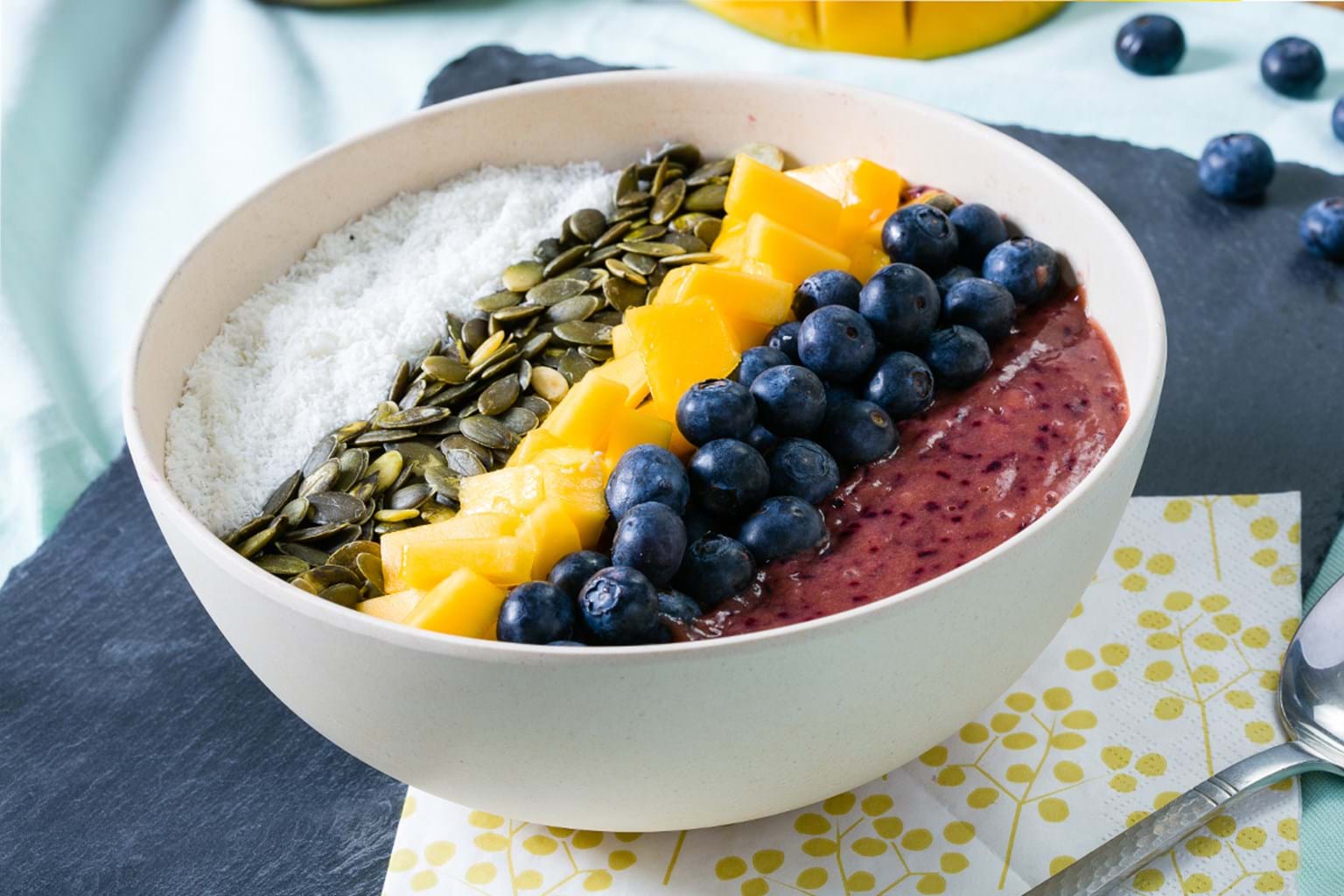 smoothie bowl with mango and berries in mixer Stock Photo - Alamy